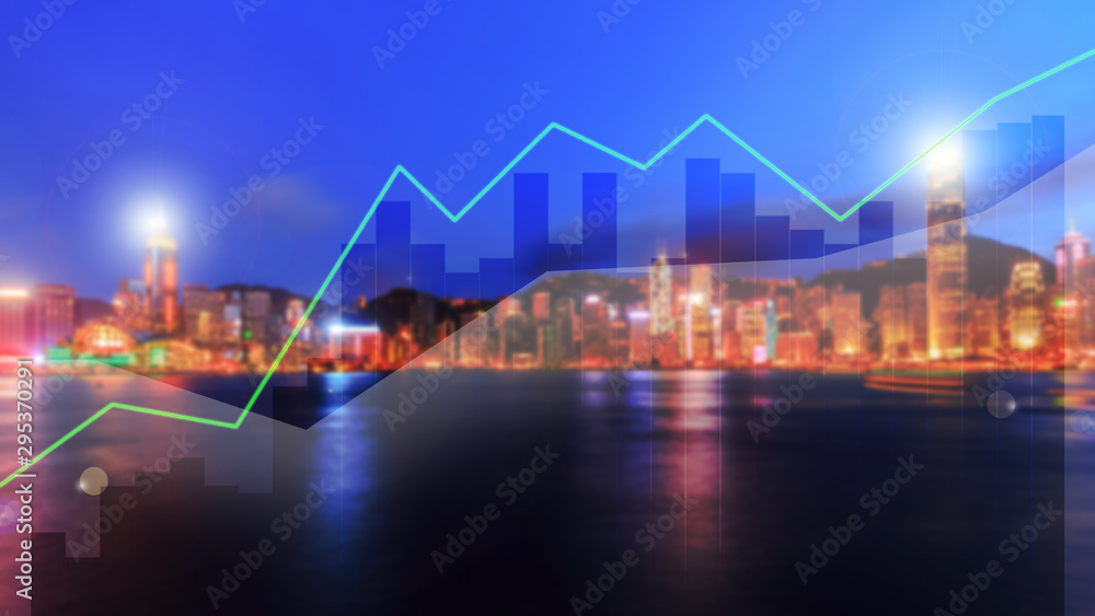 Double exposure business trading graph on blur city night background Double exposure business trading graph on blur city night background