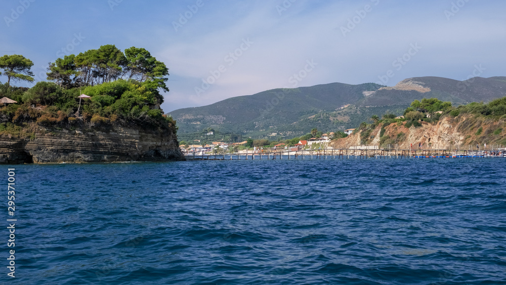 Zakynthos Island, Greece - September 11, 2019: Cameo Island is available through a picturesque wood bridge in the port of Agios Sostis, next to Laganas Resort. Beauty of nature concept background 