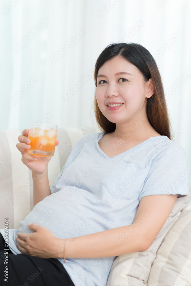 Healthy belly pregnant women with orange juice Healthy belly pregnant women with orange juice