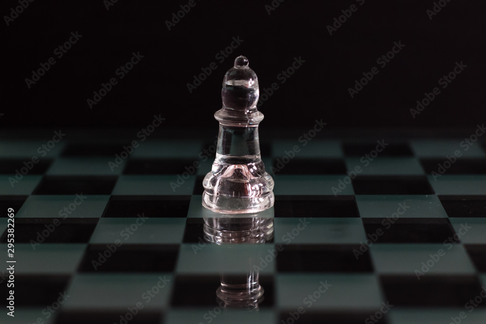 Transparent bishop chess piece on black background Transparent bishop chess piece on black background