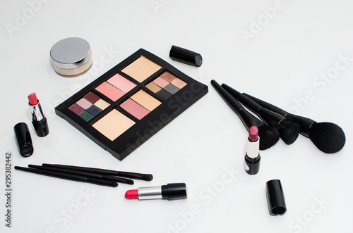 Assorted cosmetics, lipstick, eyeshadow Palette, Makeup Brush , isolated on white background