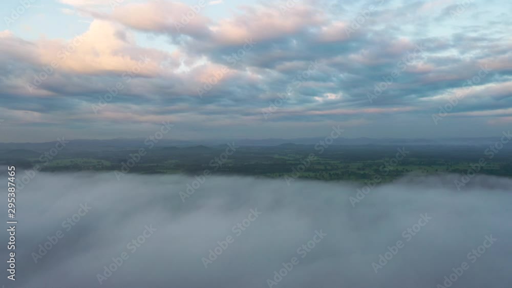 Aerial View of Sunrise. Flying in fog.Flight above clouds Aerial View of Sunrise. Flying in fog.Flight above clouds