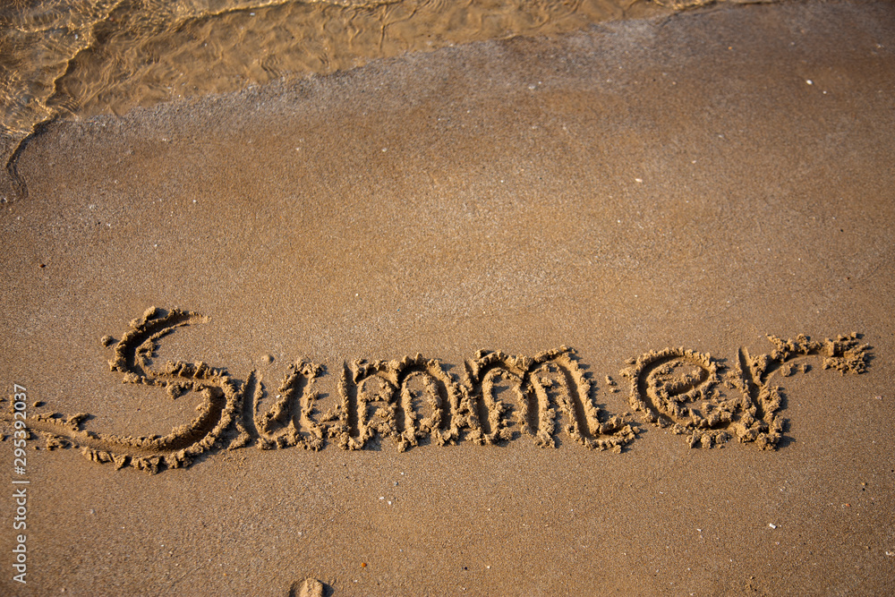 Fototapeta premium Sandy, sea shore, the waves are coming.