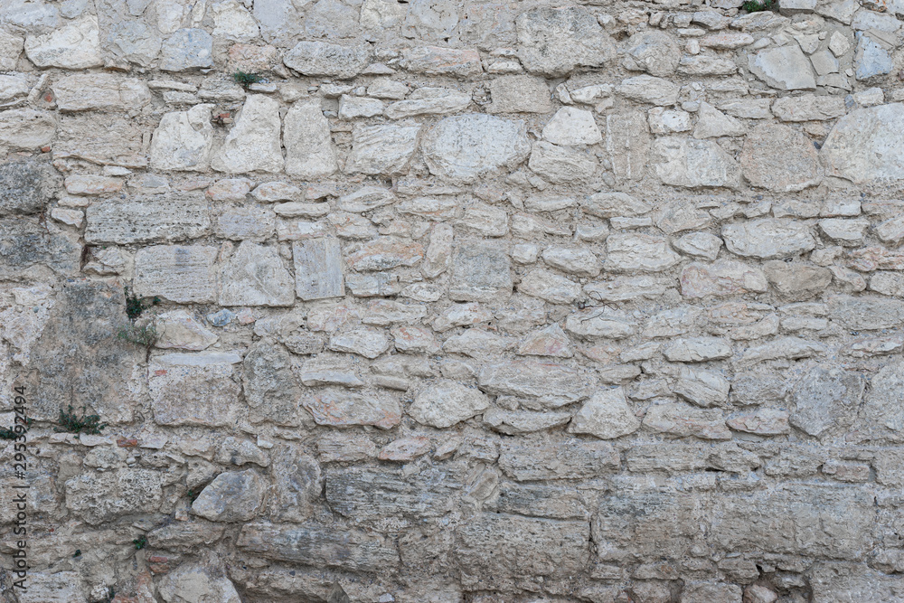 Fondo con textura de muro antiguo de piedra Fondo con textura de muro antiguo de piedra