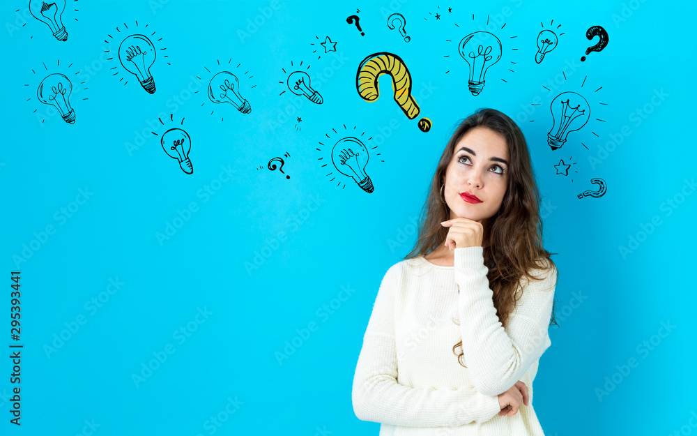 Fototapeta premium Question with light bulbs with young woman in a thoughtful face