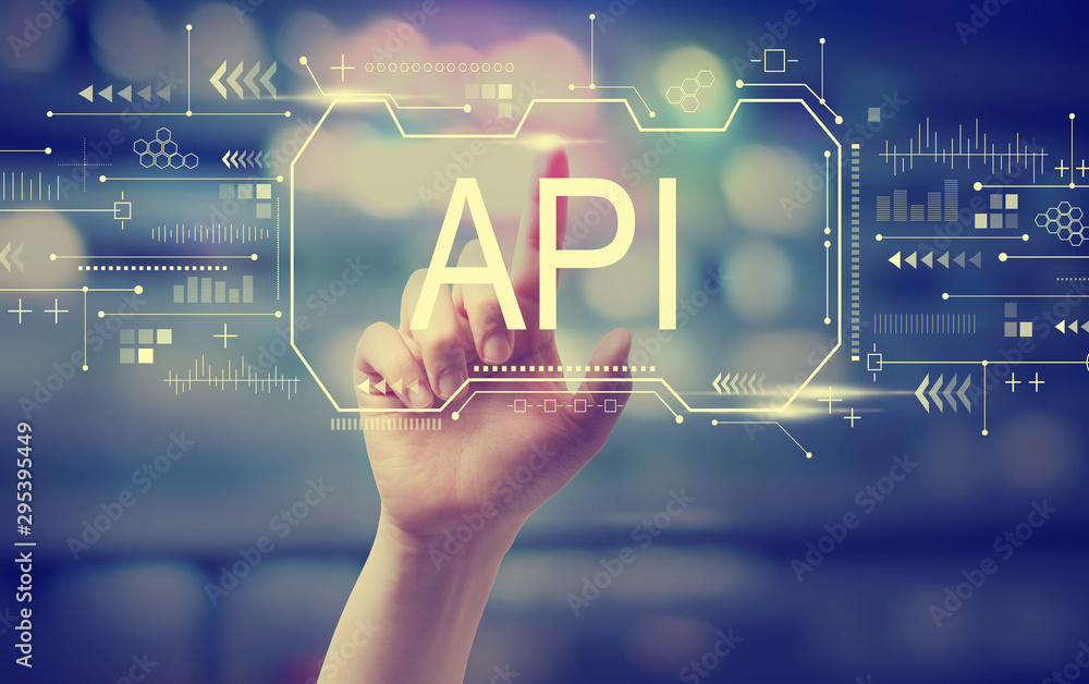 API concept with hand pressing a button at night API concept with hand pressing a button at night