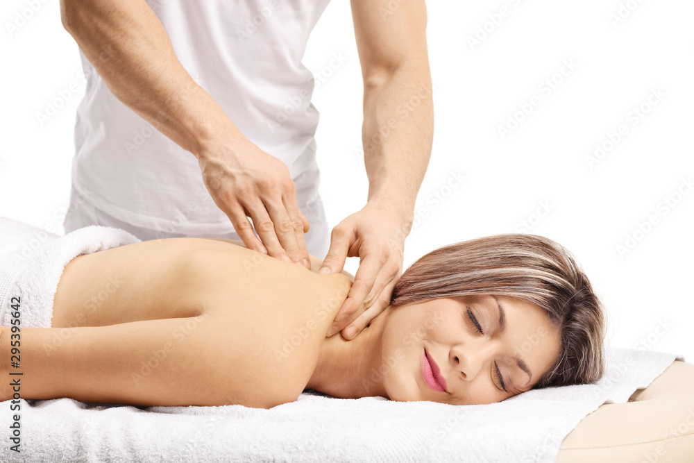 Woman enjoying a back massage with closed eyes Woman enjoying a back massage with closed eyes