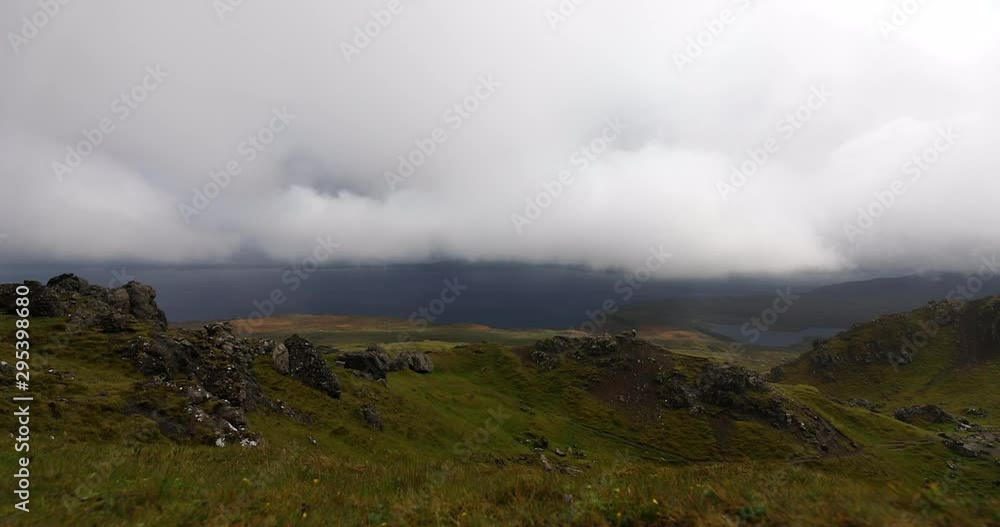 Old Man of Storr on the Isle of Skye in Scotland. Mountain landscape with foggy clouds. Old Man of Storr on the Isle of Skye in Scotland. Mountain landscape with foggy clouds.