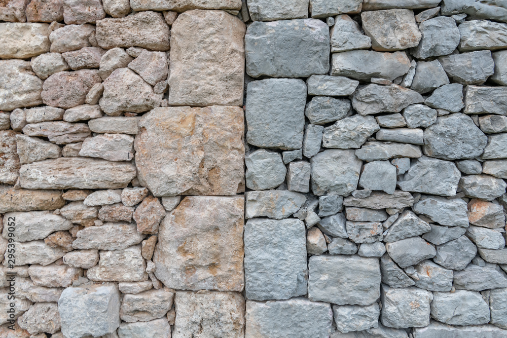 Old stone wall of stones with different stone colors Old stone wall of stones with different stone colors