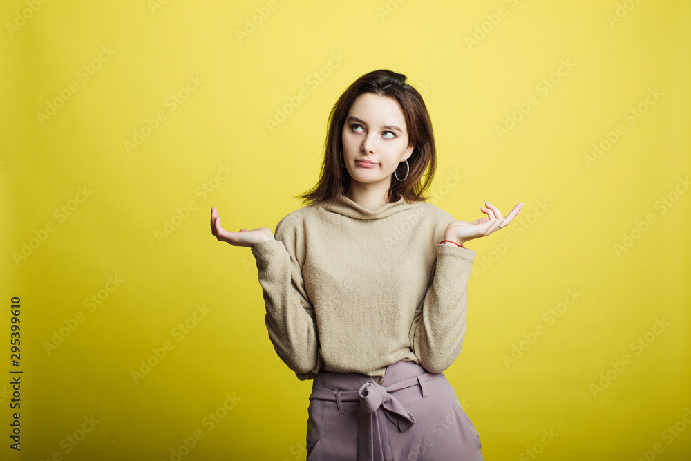 Image of happy young girl standing isolated over yellow background. Girl Image of happy young girl standing isolated over yellow background. Girl