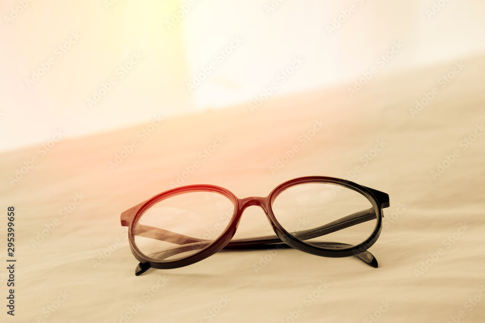 Reading eyeglasses close up with book and heart Reading eyeglasses close up with book and heart