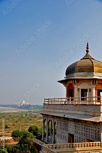 The octagonal tower where Emperor Shah Jehan was imprisoned. In the distance is the Taj Mahal the mausoleum to his beloved wife Mumtaz Mahal. photo