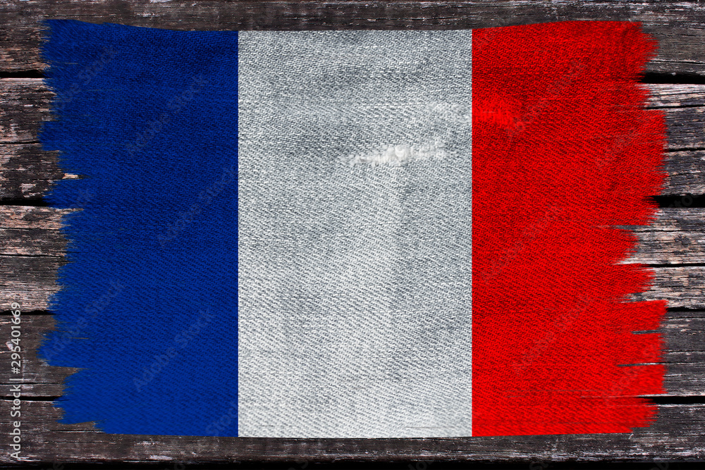 photo of the beautiful colored national flag of the modern state of France on textured fabric, concept of tourism, emigration, economics and politics, closeup