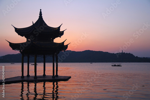 Sunset with a pagoda on the beautiful Hangzhou lake