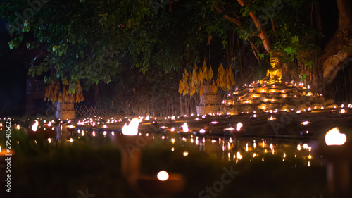 Candle Light with Buddha Statue at Wat Pan Tao Temple with beautiful water reflection in Phan Tao Temple  Chiangmai  Thailand