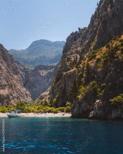 The beautiful and iconic Butterfly Valley in Fethiye, Turkey. The large cliffs and mountains surround the remote beach below.  © Dylan Alcock
