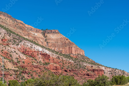 Low angle landscape of multi-colored stone mountain in Jemez National Recreation Area in New Mexico
