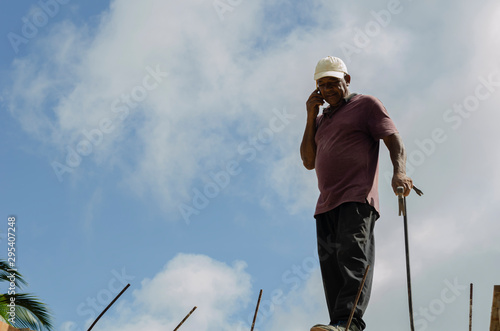 Canvas Print Man On Phone Against Sky Background