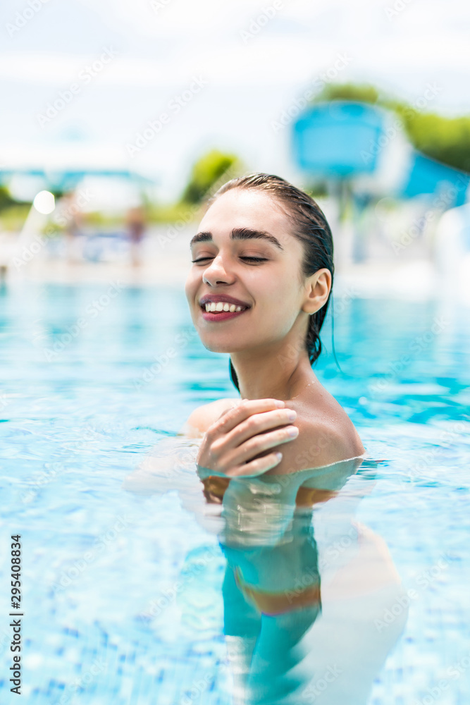 Young pretty woman in the swimming pool