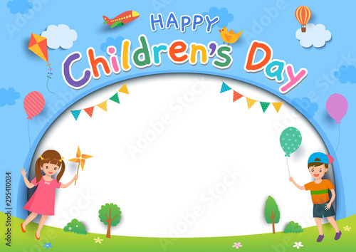 Happy Children's Day with boy and girl playing toys on lawn