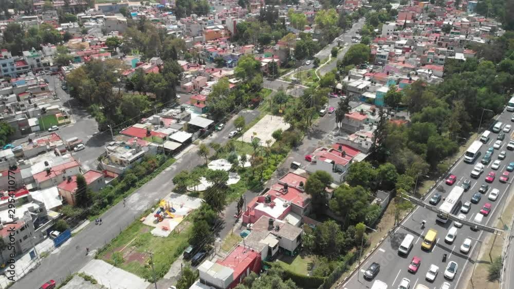 Aerial view of the houses around Atzacoalco, Mexico City. Drone slowly descending Aerial view of the houses around Atzacoalco, Mexico City. Drone slowly descending