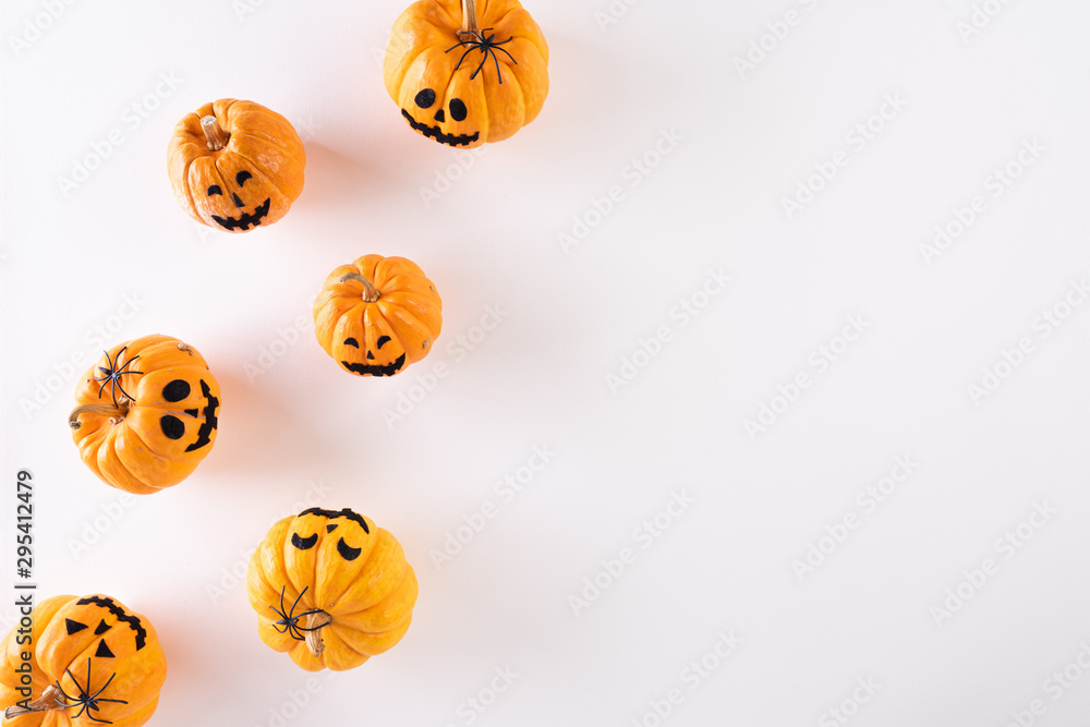 Top view of Halloween crafts, orange pumpkin, ghost on white background with copy space for text. halloween concept.