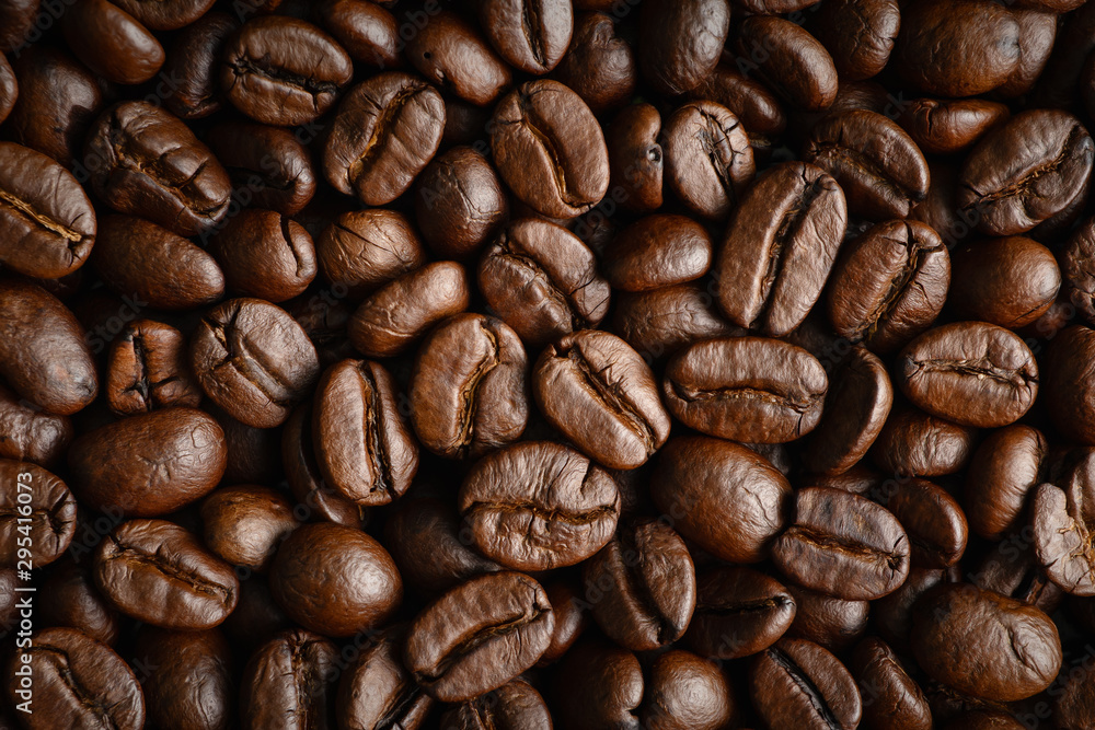 closeup background of roasted arabica coffee beans closeup background of roasted arabica coffee beans