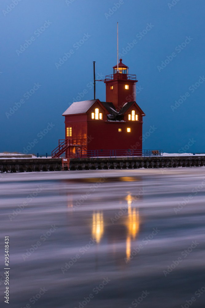 lighthouse in winter with reflection