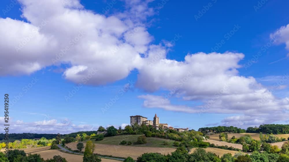 timelapse of the french village of Lavardens in the Gers with blue sky and white clouds timelapse of the french village of Lavardens in the Gers with blue sky and white clouds