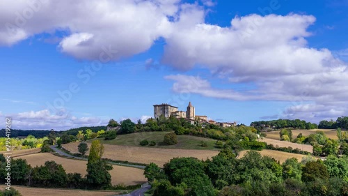 timelapse of the french village of Lavardens in the Gers with blue sky and white clouds