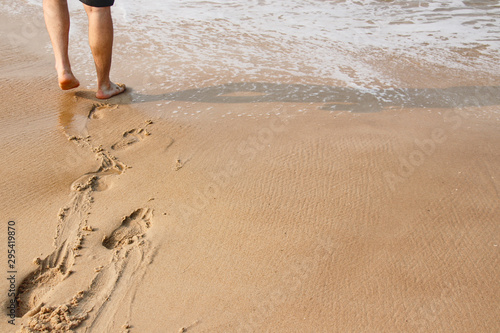 Walking along the beach on a bright summer day