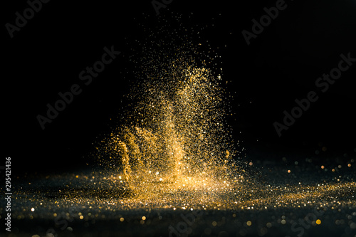 glitter lights grunge background, gold glitter defocused abstract Twinkly gold Lights Background. photo