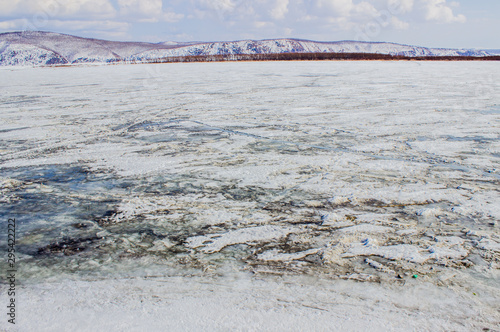 Bild auf Leinwand Landscape on the river and hills. Frozen river