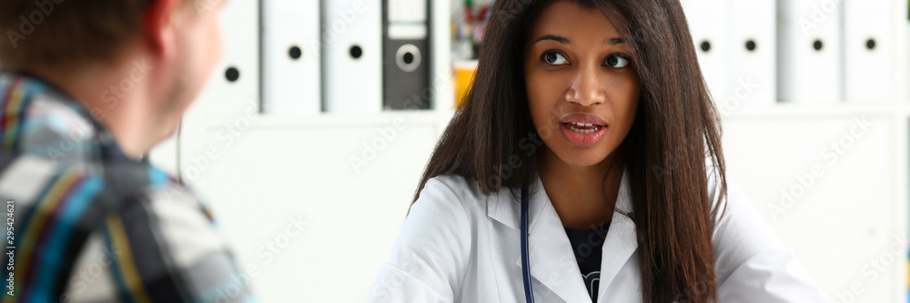 Female medicine doctor hand hold jar of pills and write prescription to patient at worktable. Panacea and life save, prescribing treatment, legal drug store concept. Empty form ready to be used