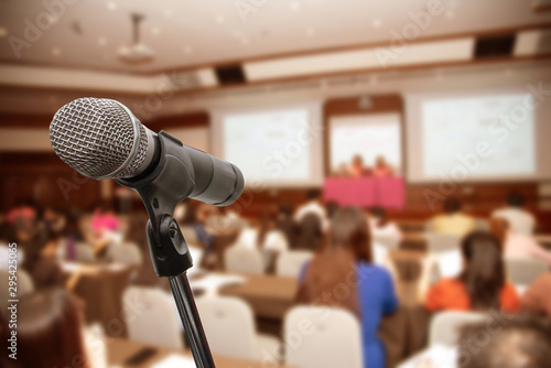 Microphone over the blurred business people forum Meeting Conference Training Learning Coaching Concept, Blurred background.