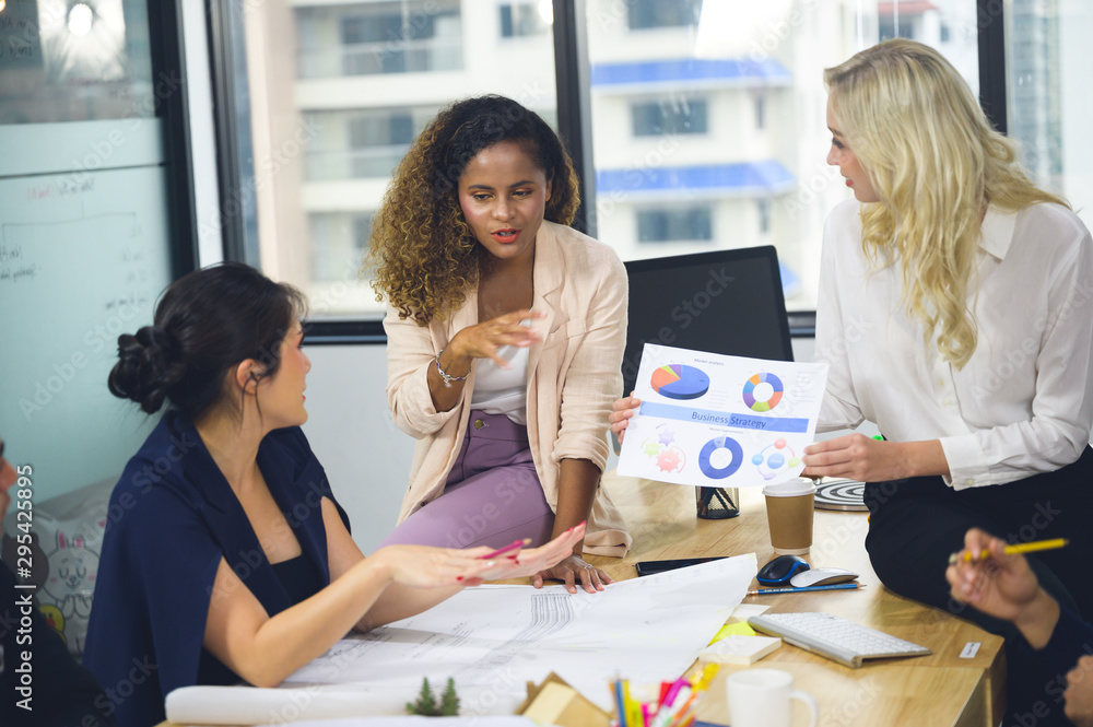 A group of freelance workers and tranning students are discussing and brain stroming for project presentation A group of freelance workers and tranning students are discussing and brain stroming for project presentation