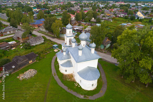 Ancient Church of the Nativity of the Blessed Virgin Mary in a cityscape on august morning (aerial photography). Kargopol, Russia photo