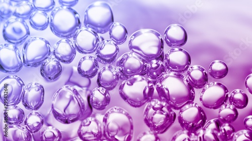 transparent gas bubbles on water surface. Worms-eye low angle with crystal bubbles in purified water on pink, purple, violet background. cosmetic backdrop with copy space