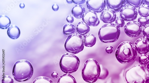 transparent gas bubbles on water surface. Worms-eye low angle with crystal bubbles in purified water on pink  purple  violet background. cosmetic backdrop with copy space