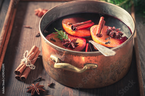 Closeup of strong mulled red wine with cloves and anise photo