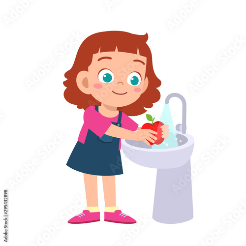 happy cute kid girl wash vegetable fruit clean