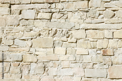 Wall of the old castle made of sandstone.