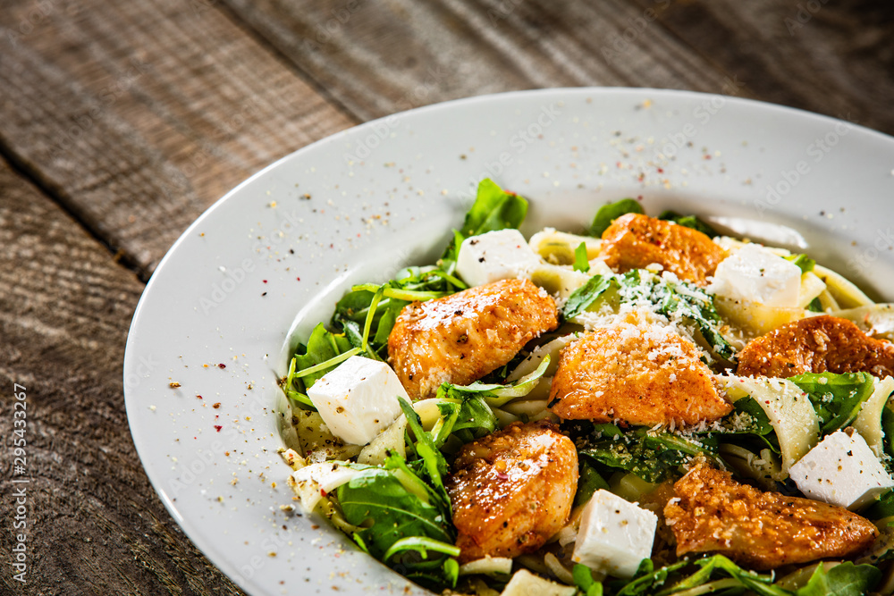 Pasta with chicken meat, feta cheese and rucola Pasta with chicken meat, feta cheese and rucola