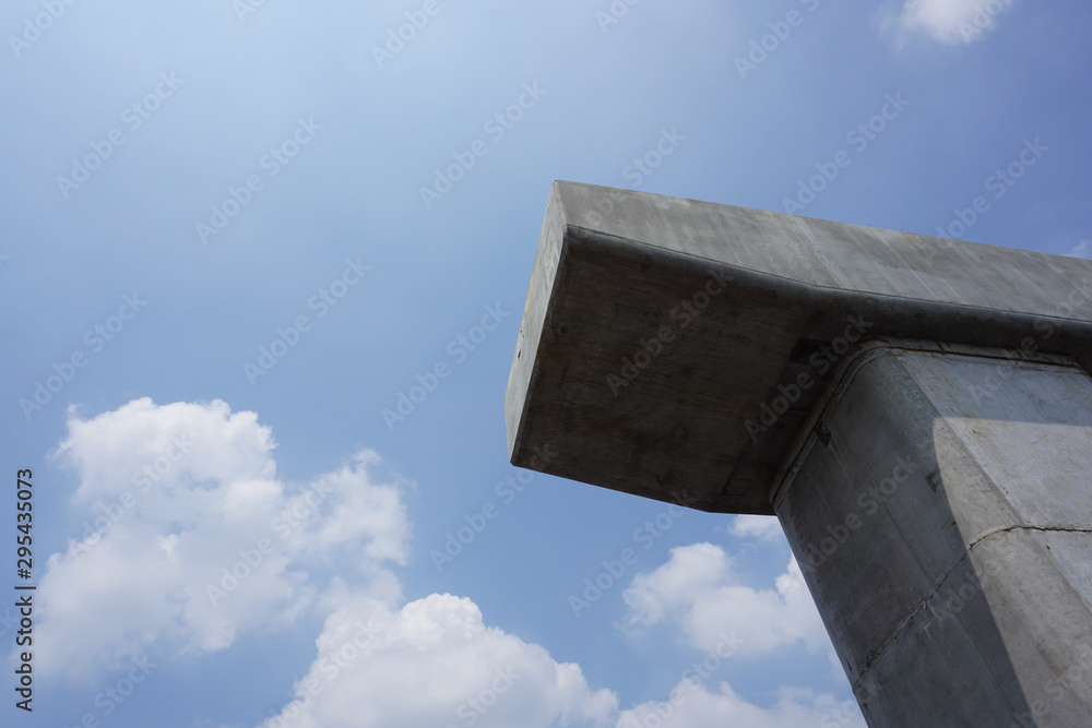 A concrete pier of the skytrain under blue sky A concrete pier of the skytrain under blue sky