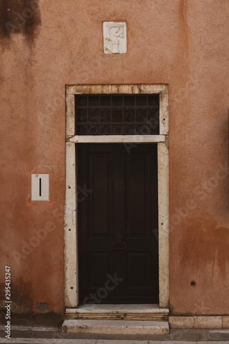 old wooden door in brick wall