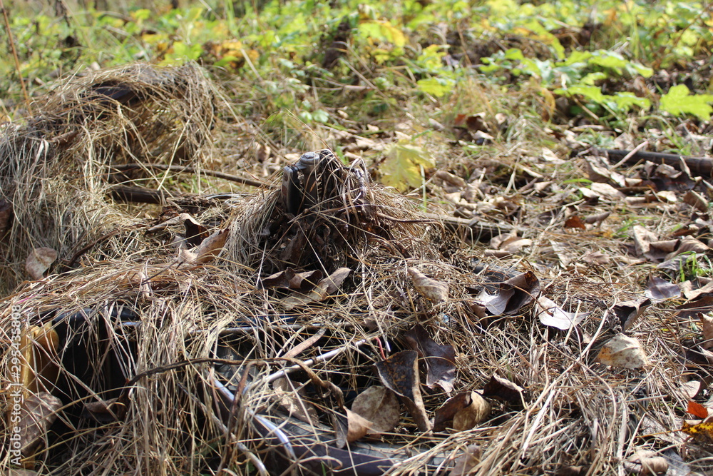 photo of an old bike. he's lying on the ground. transport overgrown with dry grass.this place is a swamp.the fall of the year. photo of an old bike. he's lying on the ground. transport overgrown with dry grass.this place is a swamp.the fall of the year.