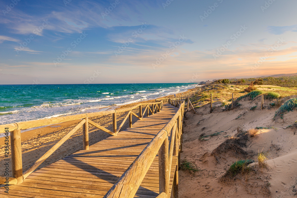 wooden footbridge descending towards the guardamar beach in Alicante. Spain