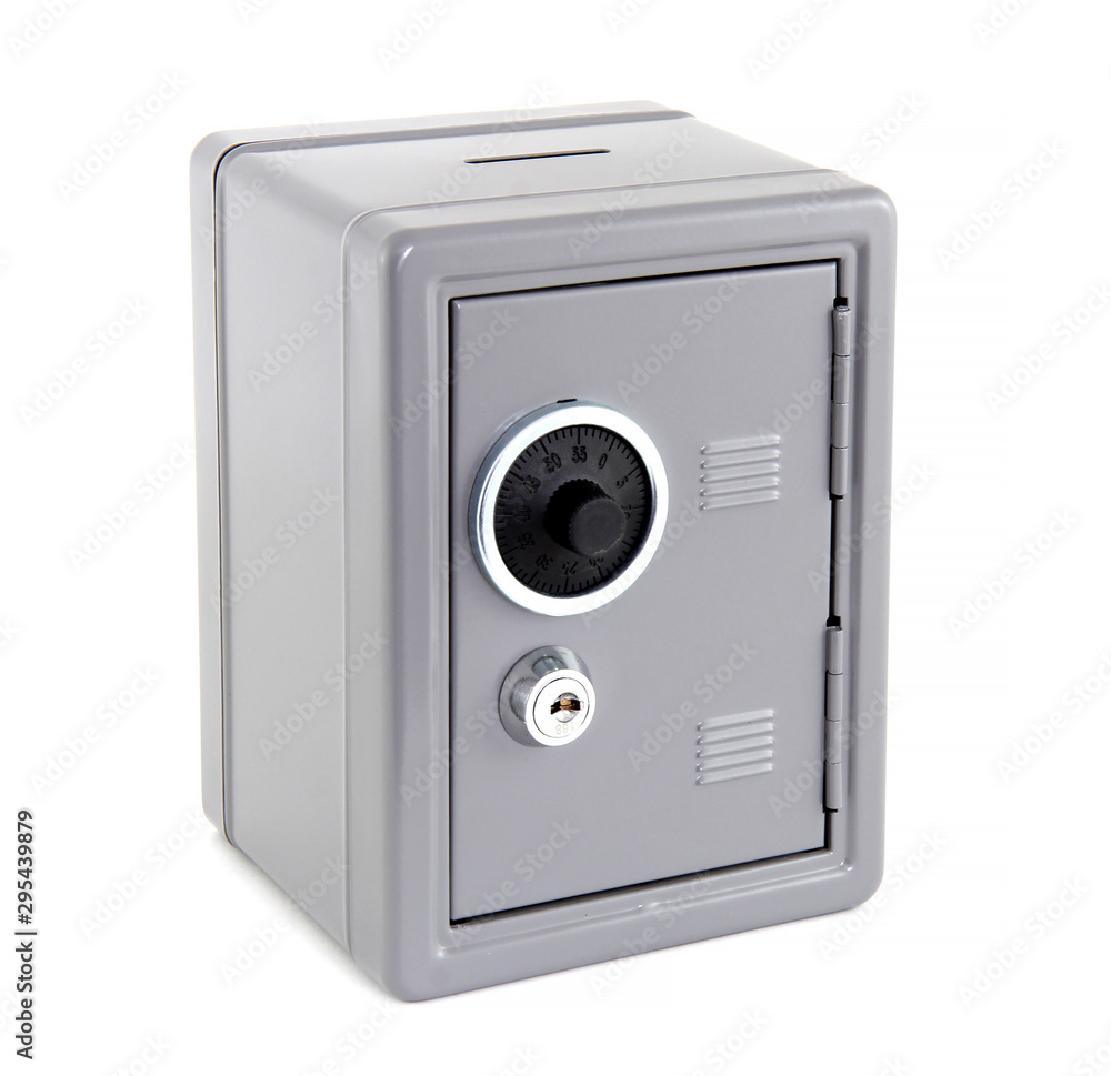 Silver metal safe box isolated on white background. The safe has both key and numeric opening. It is a safe place for money, documents and valuables. Silver metal safe box isolated on white background. The safe has both key and numeric opening. It is a safe place for money, documents and valuables.