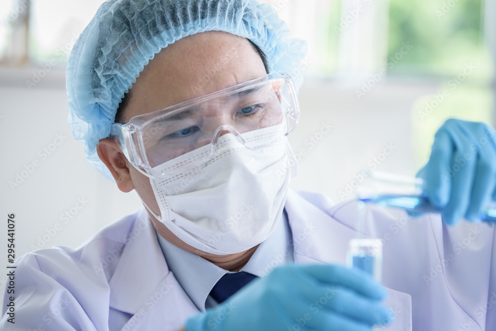 Asian man scientist researching and learning in a laboratory. Asian man scientist researching and learning in a laboratory.