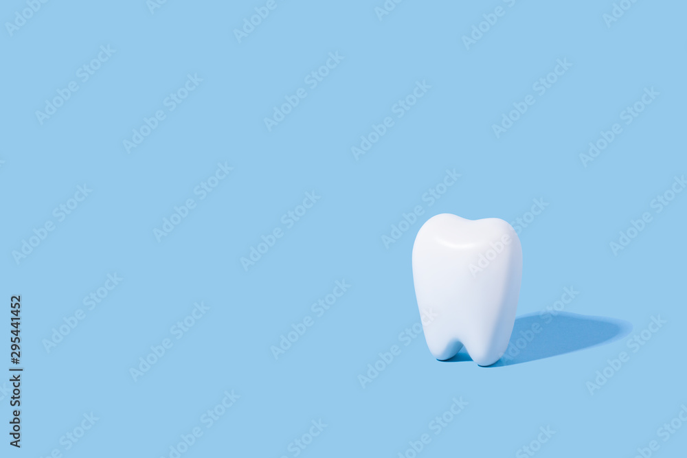 White teeth pattern on a blue paper background. White teeth pattern on a blue paper background.